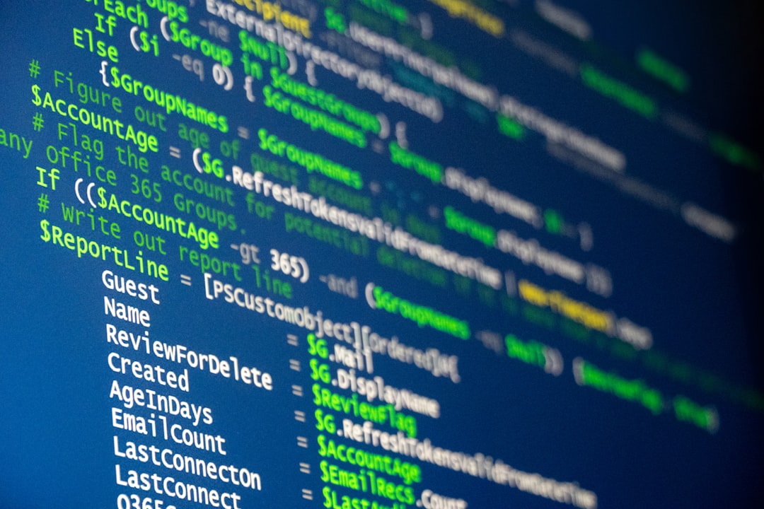 Computer code is displayed on a screen.