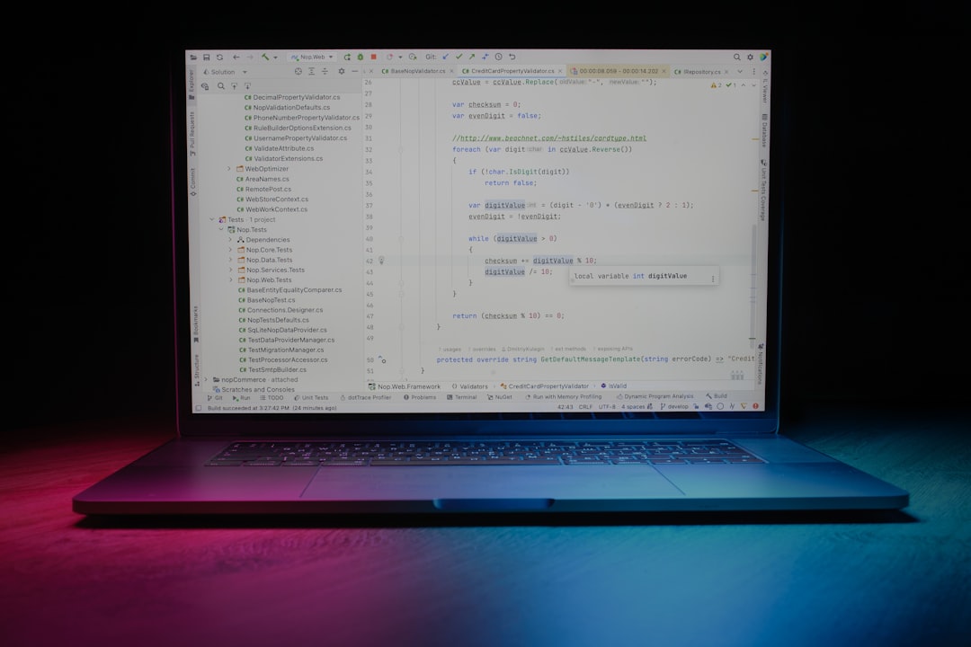 Laptop screen displaying code with colorful lighting.