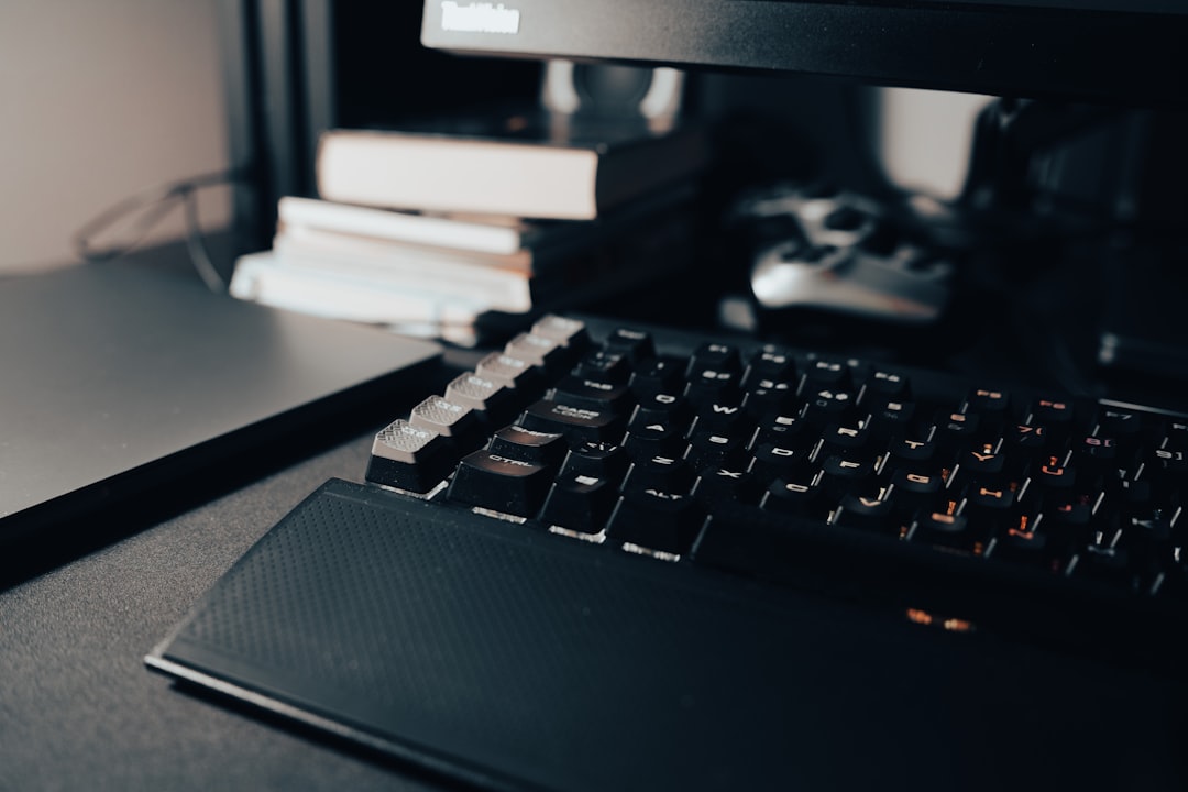 a computer keyboard sitting on top of a desk