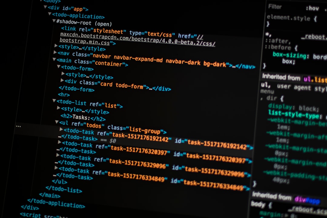 turned on monitor displaying programming language